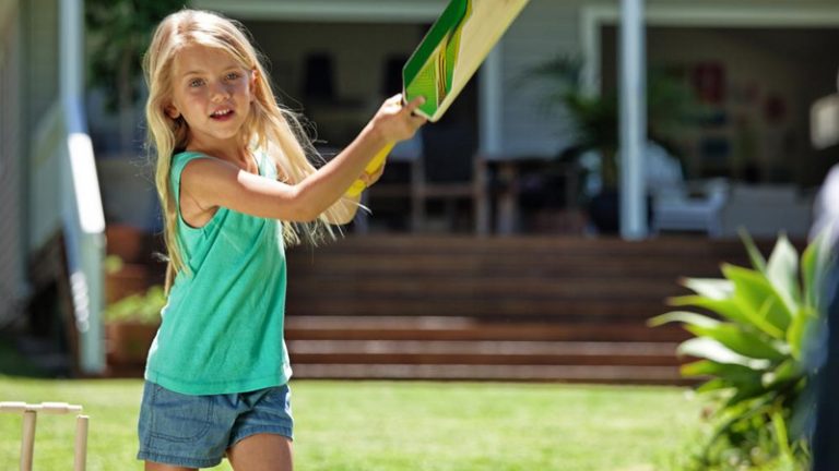 Kid playing cricket