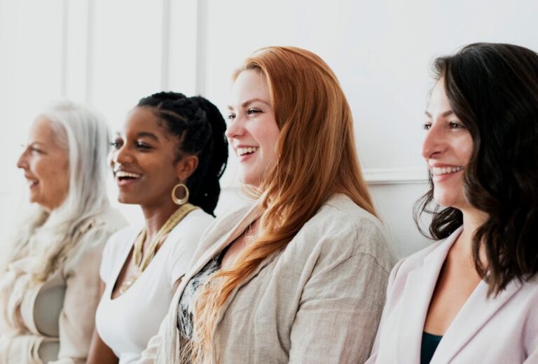 4 professional women happily smiling